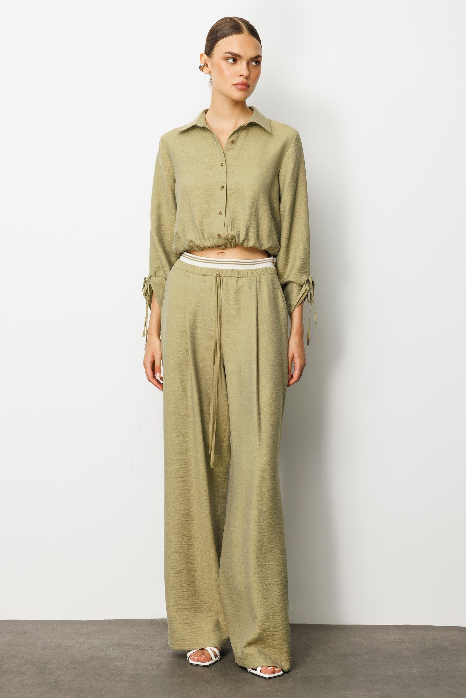 Modailgi  Beli Lastik ve Ribana Detaylı Bol Paça Pileli Yandan Cepli Yüksek Bel Pantolon - 10037 Yağ Yeşili