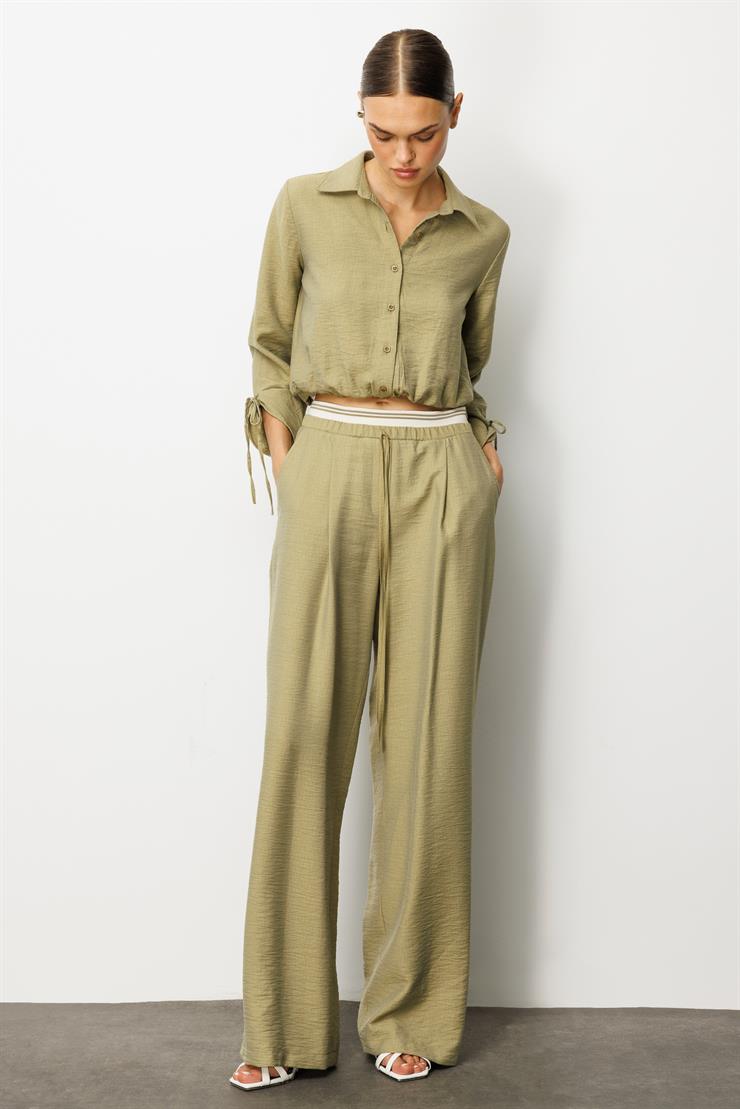 Modailgi  Beli Lastik ve Ribana Detaylı Bol Paça Pileli Yandan Cepli Yüksek Bel Pantolon - 10037 Yağ Yeşili