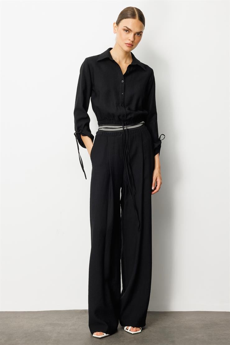 Modailgi  Beli Lastik ve Ribana Detaylı Bol Paça Pileli Yandan Cepli Yüksek Bel Pantolon - 10037 Siyah