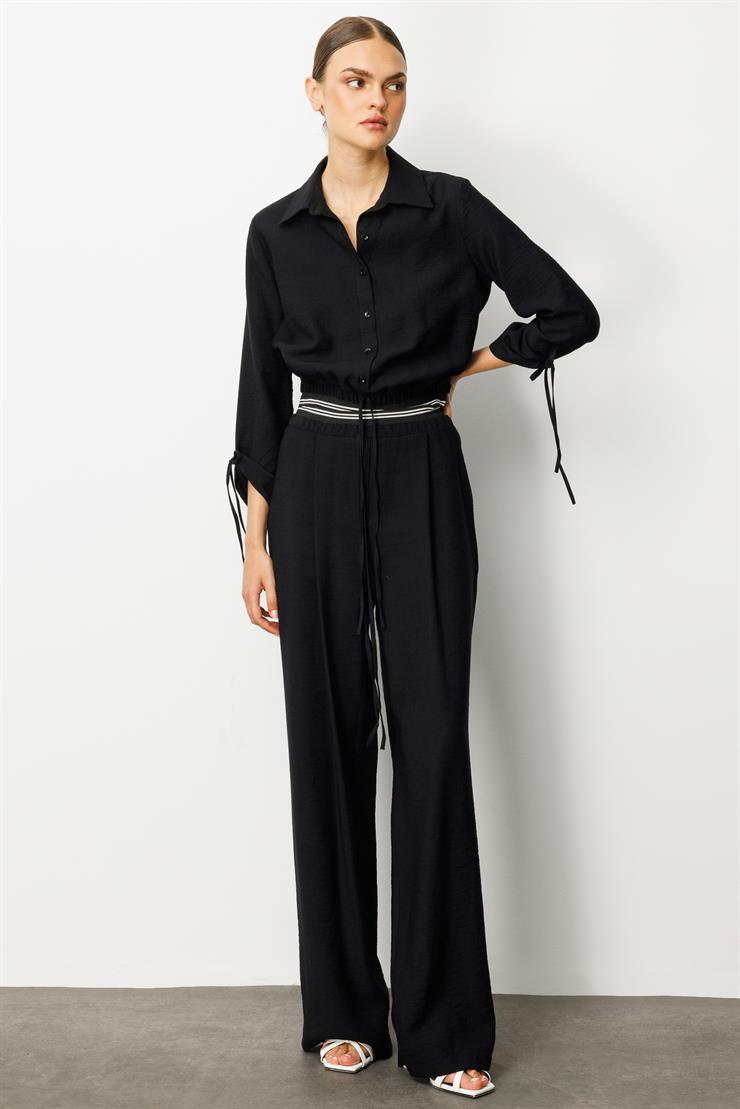 Modailgi  Beli Lastik ve Ribana Detaylı Bol Paça Pileli Yandan Cepli Yüksek Bel Pantolon - 10037 Siyah