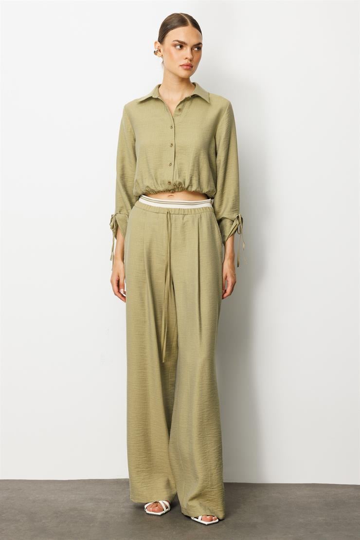 Modailgi  Beli Lastik ve Ribana Detaylı Bol Paça Pileli Yandan Cepli Yüksek Bel Pantolon - 10037 Yağ Yeşili