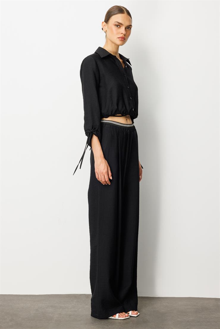 Modailgi  Beli Lastik ve Ribana Detaylı Bol Paça Pileli Yandan Cepli Yüksek Bel Pantolon - 10037 Siyah