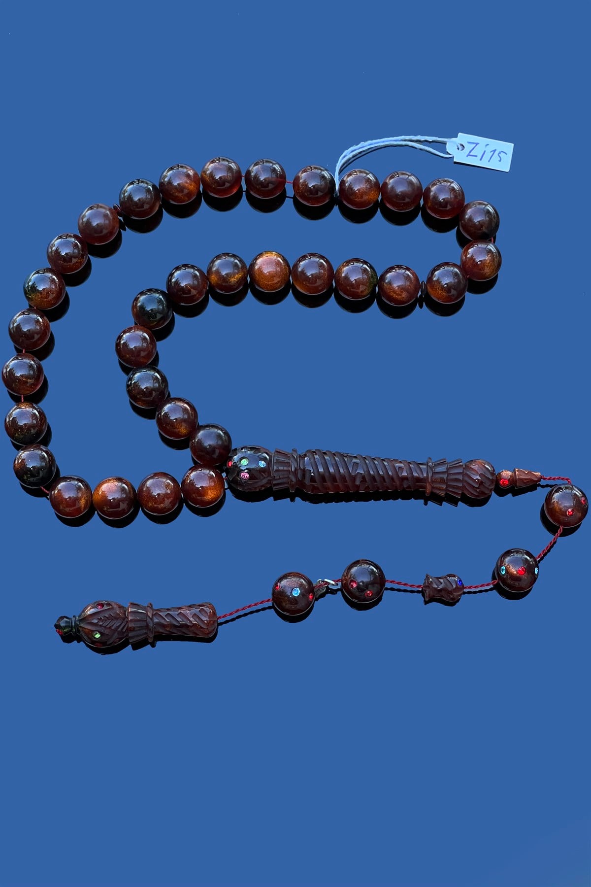 Zirkon İşlemeli Ateş Kehribar TesbihZirkon İşlemeli Ateş Kehribar Tesbih - Kevser AntikÖZEL SERİ TESBİHLER