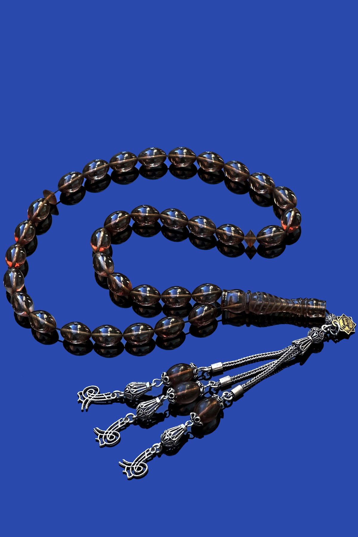 Dev Gümüş Püsküllü Ateş KehribarDev Gümüş Püsküllü Ateş Kehribar - Kevser AntikSıkma-Ateş Kehribar Tesbihler