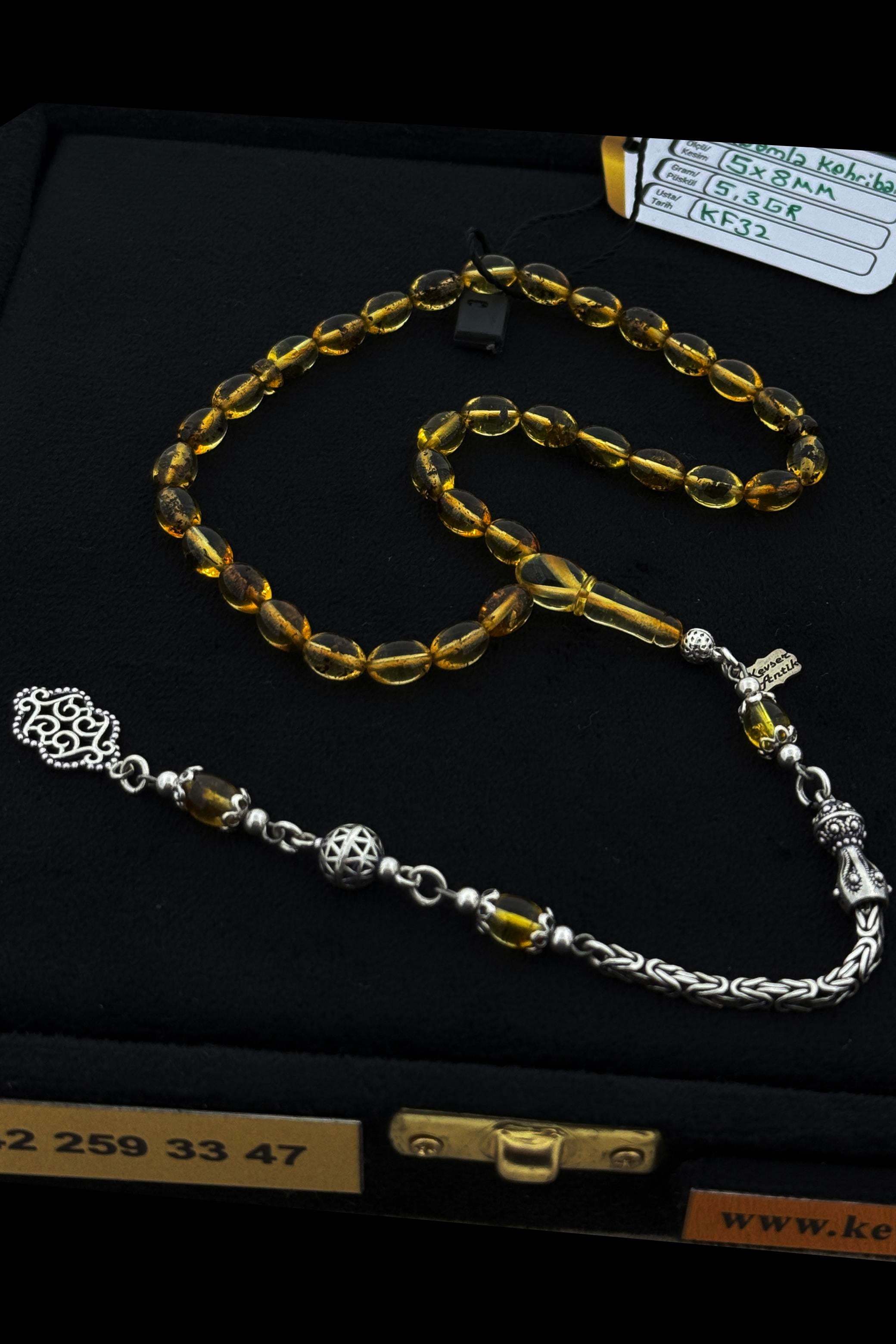 Fosilli Amber Tesbih – Şeffaf, El İşçiliğiFosilli Amber Tesbih – Şeffaf, El İşçiliği - Kevser AntikDamla Kehribar Tesbihler