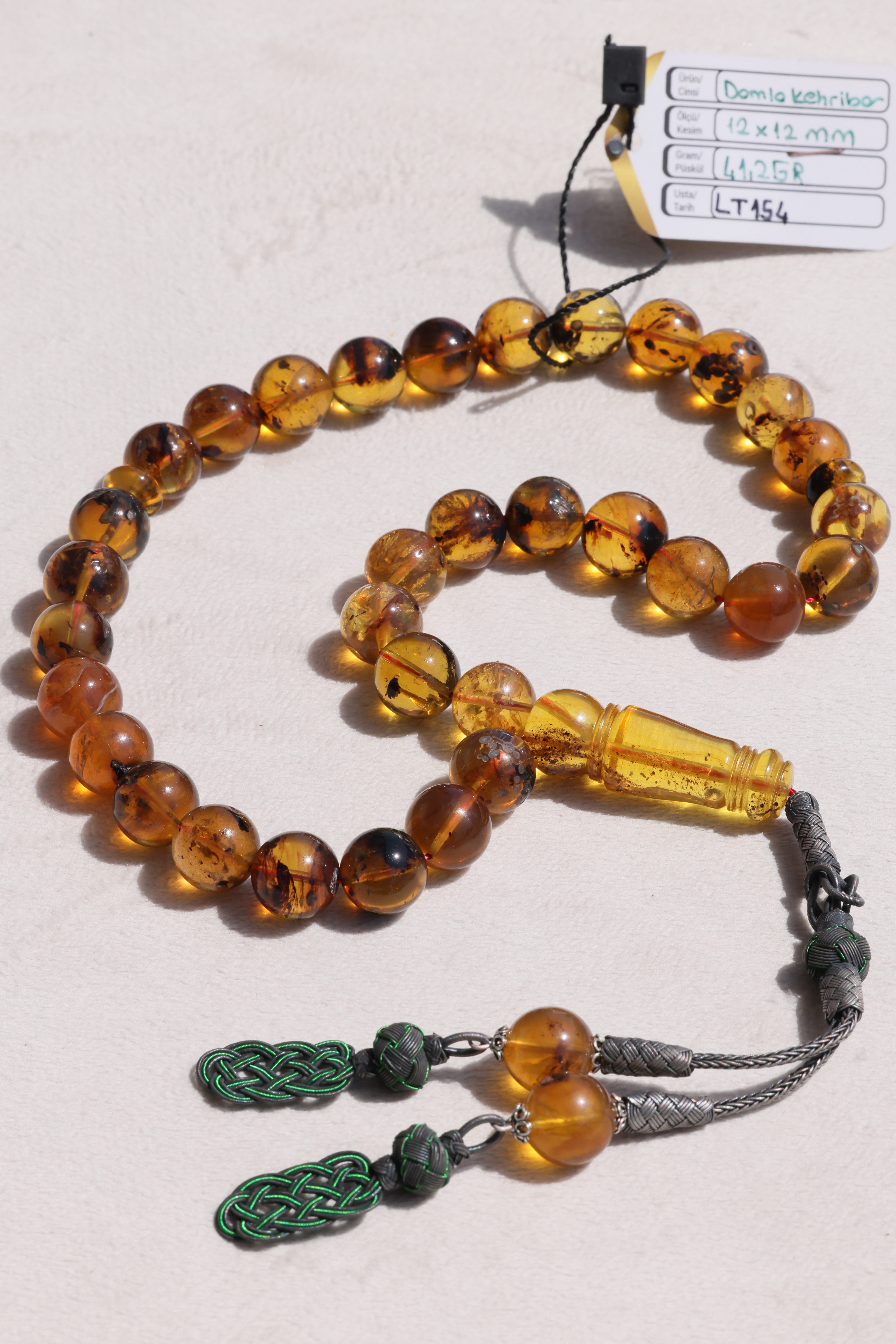 Fosilli Damla Kehribar Tesbih – Kazaz PüskülFosilli Damla Kehribar Tesbih – Kazaz Püskül - Kevser AntikDamla Kehribar Tesbihler