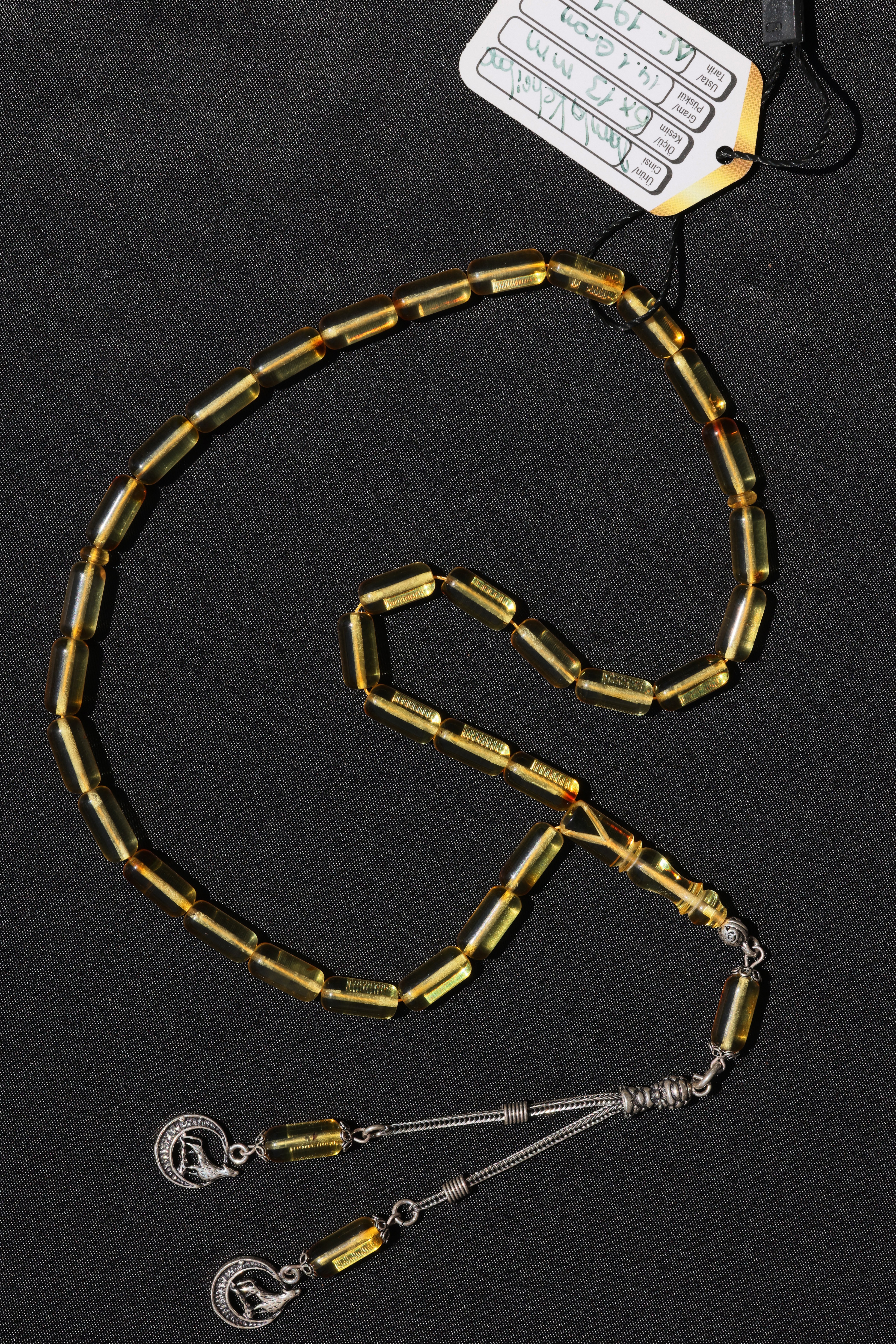 Gümüş Püsküllü Damla Kehribar Tesbih – El İşçiliğiGümüş Püsküllü Damla Kehribar Tesbih – El İşçiliği - Kevser AntikDamla Kehribar Tesbihler