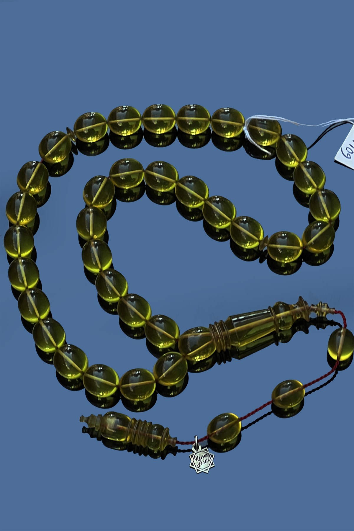 Şeffaf Ateş Kehribar TesbihŞeffaf Ateş Kehribar Tesbih - Kevser AntikSıkma-Ateş Kehribar Tesbihler