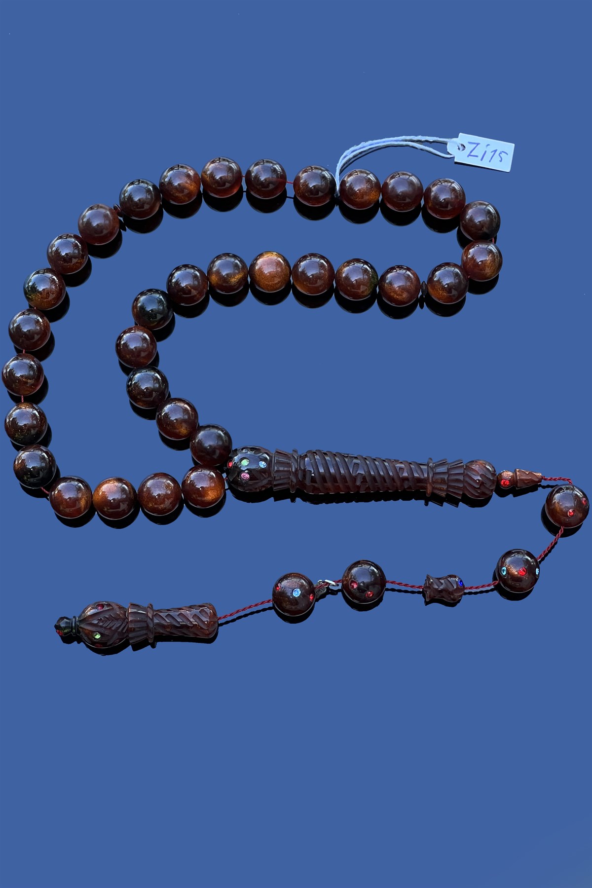 Zirkon İşlemeli Ateş Kehribar TesbihZirkon İşlemeli Ateş Kehribar Tesbih - Kevser AntikÖZEL SERİ TESBİHLER