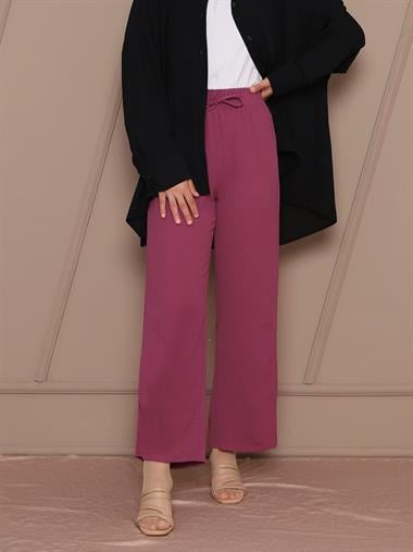 بنطلون أيروبين بخصر مطاطي وتفاصيل أربطة - خوخي