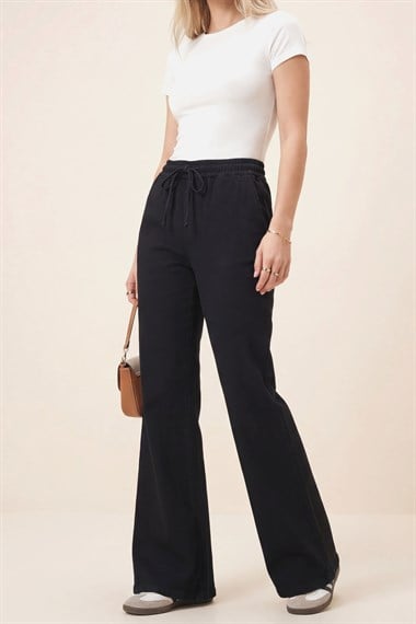 بنطال جينز واسع الساق ومفصل - أسود