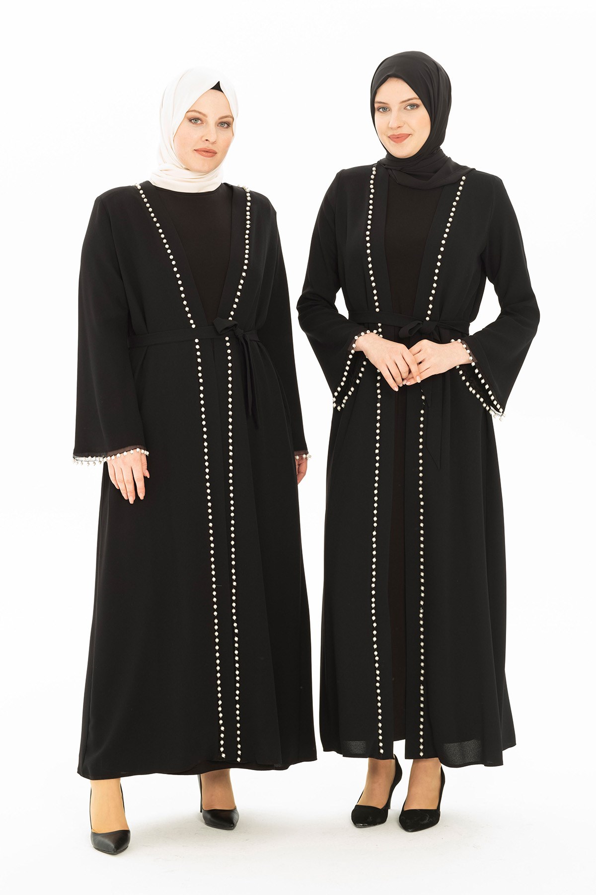 Belted, black abaya with pockets and bell sleeve, inner lining, and pearl  details on the front and sleeve.