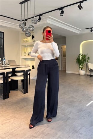 BELİ LASTİKLİ DÖKÜMLÜ BOL PAÇA PANTOLON