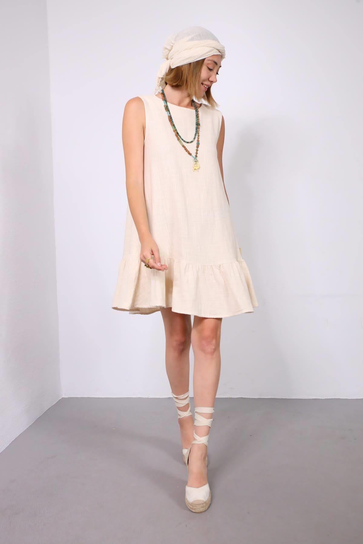 Krem Rengi Eteği Fırfırlı Kalın Askılı Kısa Keten Elbise - Şaman Butik Krem Rengi Eteği Fırfırlı Kalın Askılı Kısa Keten Elbise