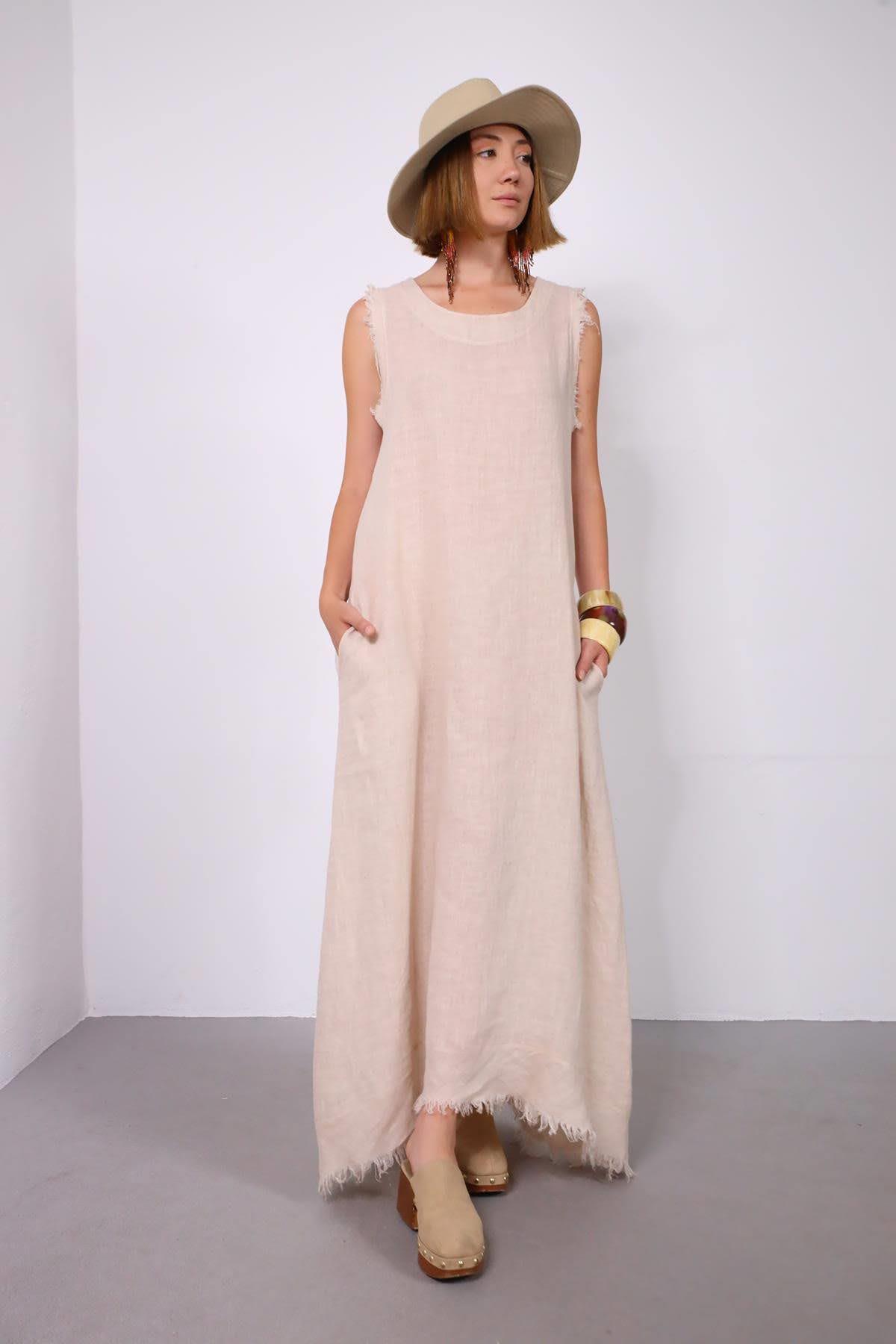 Krem Rengi Dikiş ve Püskül Detaylı Kolsuz Keten Elbise - Şaman Butik Krem Rengi Dikiş ve Püskül Detaylı Kolsuz Keten Elbise