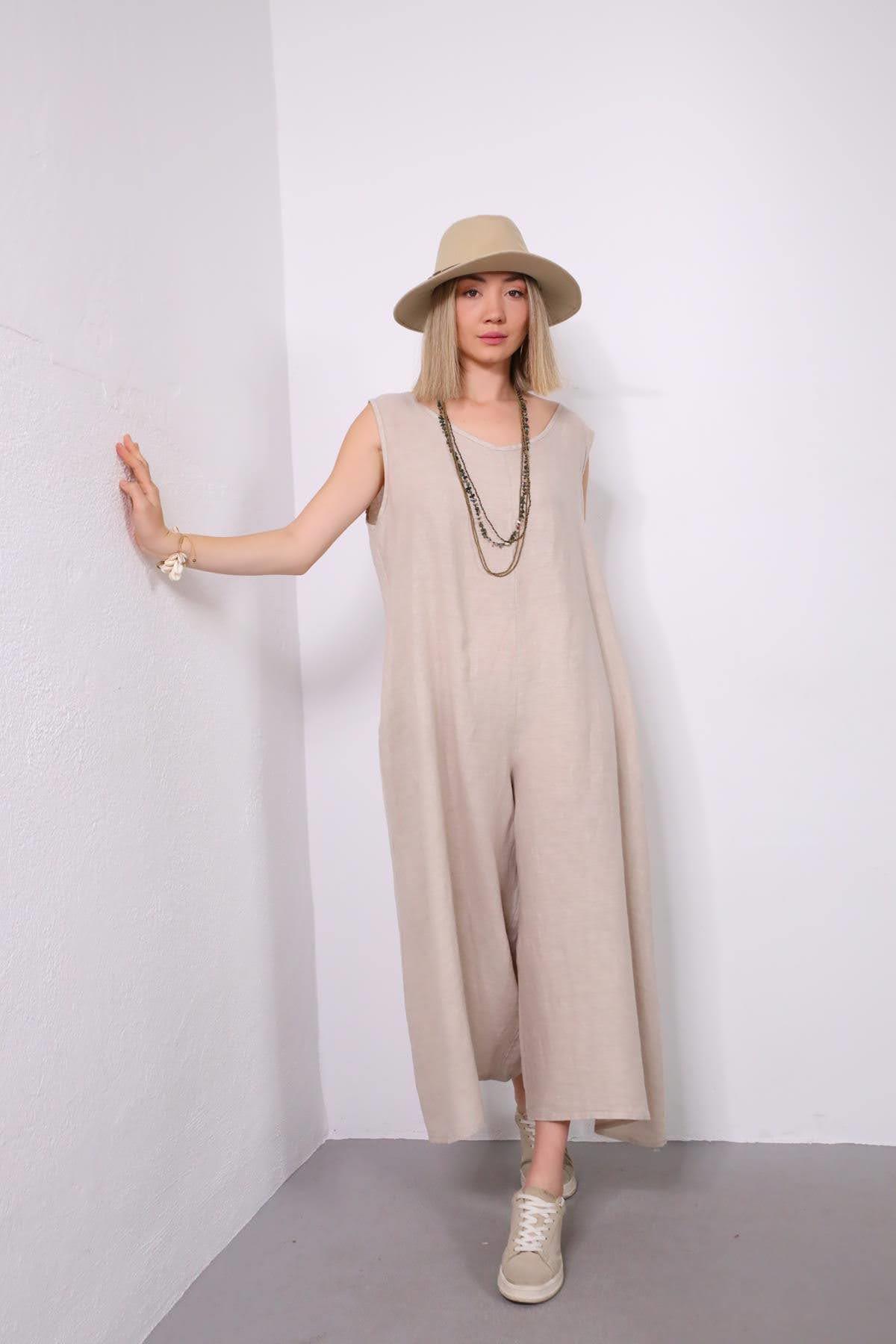 Krem Rengi Sırtı Düğmeli Düşük Ağlı Keten Tulum - Şaman Butik Krem Rengi Sırtı Düğmeli Düşük Ağlı Keten Tulum