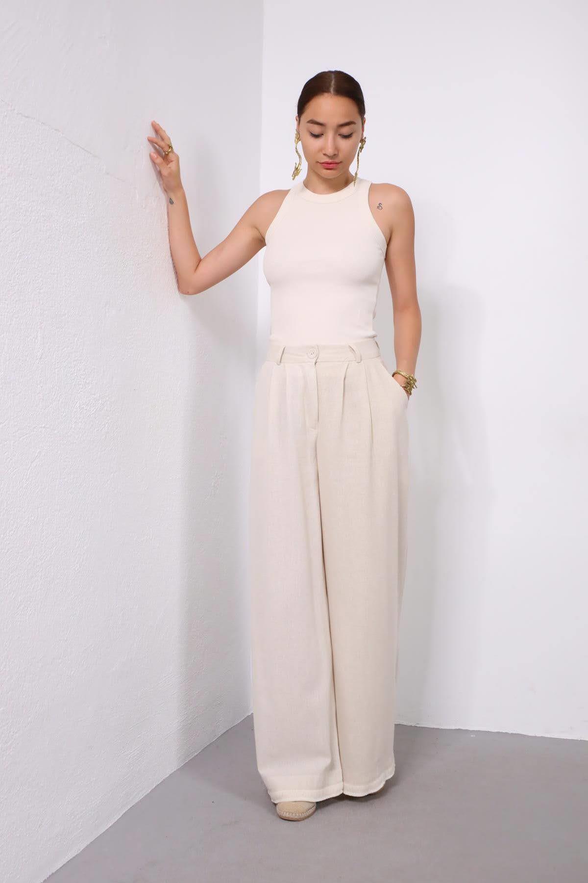 Krem Rengi Beli Pileli Paçası Tüylü Pantolon - Şaman Butik Krem Rengi Beli Pileli Paçası Tüylü Pantolon