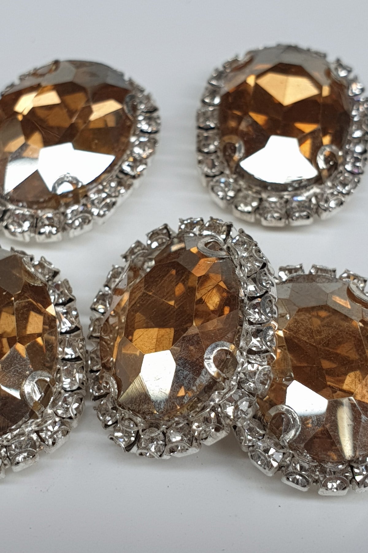 Honey Color Oval Cased Studded Stone