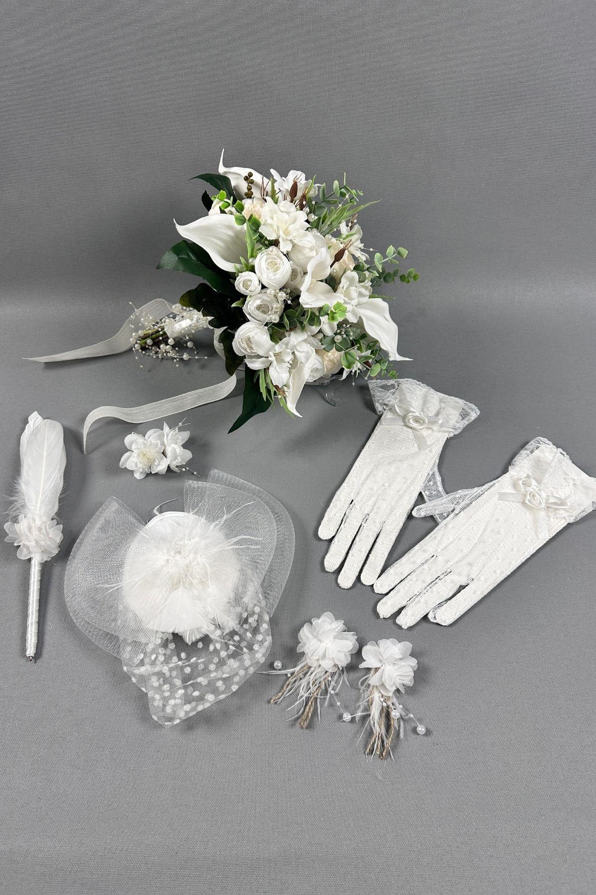 The set includes a bridal bouquet, wedding hat, feathered wedding pen, satin bridal gloves, and feathered earrings. It is a high-quality set and a designer bridal bouquet.