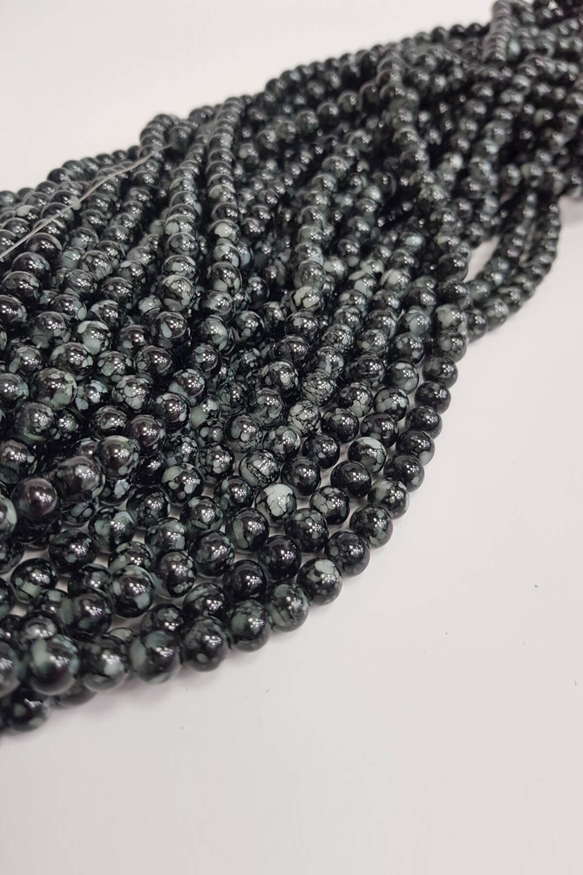 Black Patterned String Glass Beads