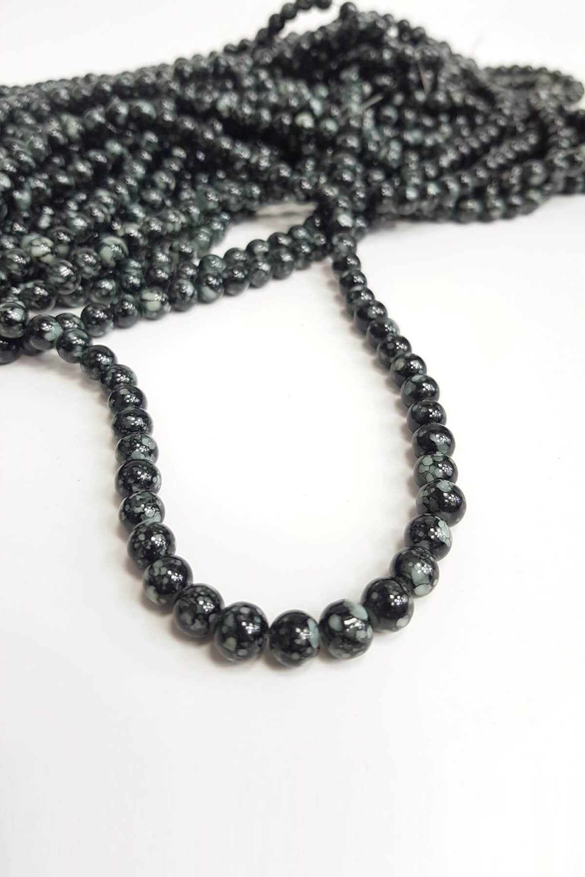Black Patterned String Glass Beads
