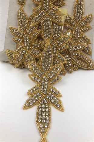 لون ذهبي مطرز بالخرز على شريط حجري