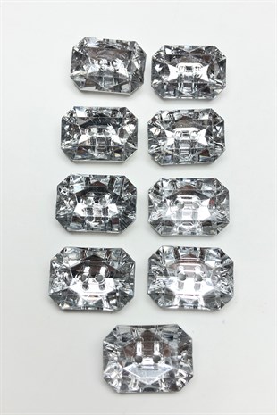 زر بلاستيك مستطيل شفاف مع ثقوب في المنتصف