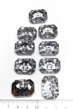 زر بلاستيك مستطيل شفاف مع ثقوب في المنتصف