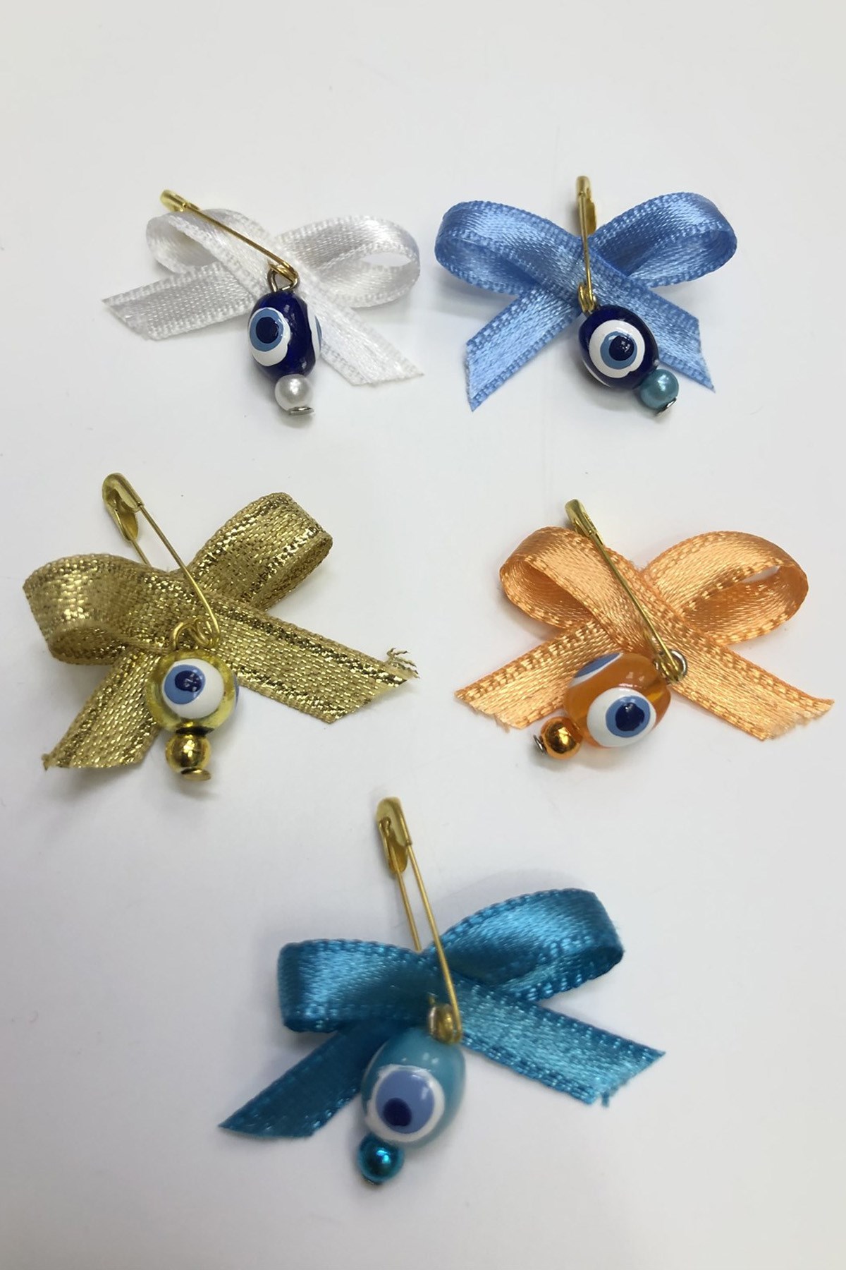 القوس الملونة وخطاف ودبوس الخرز عين الشر