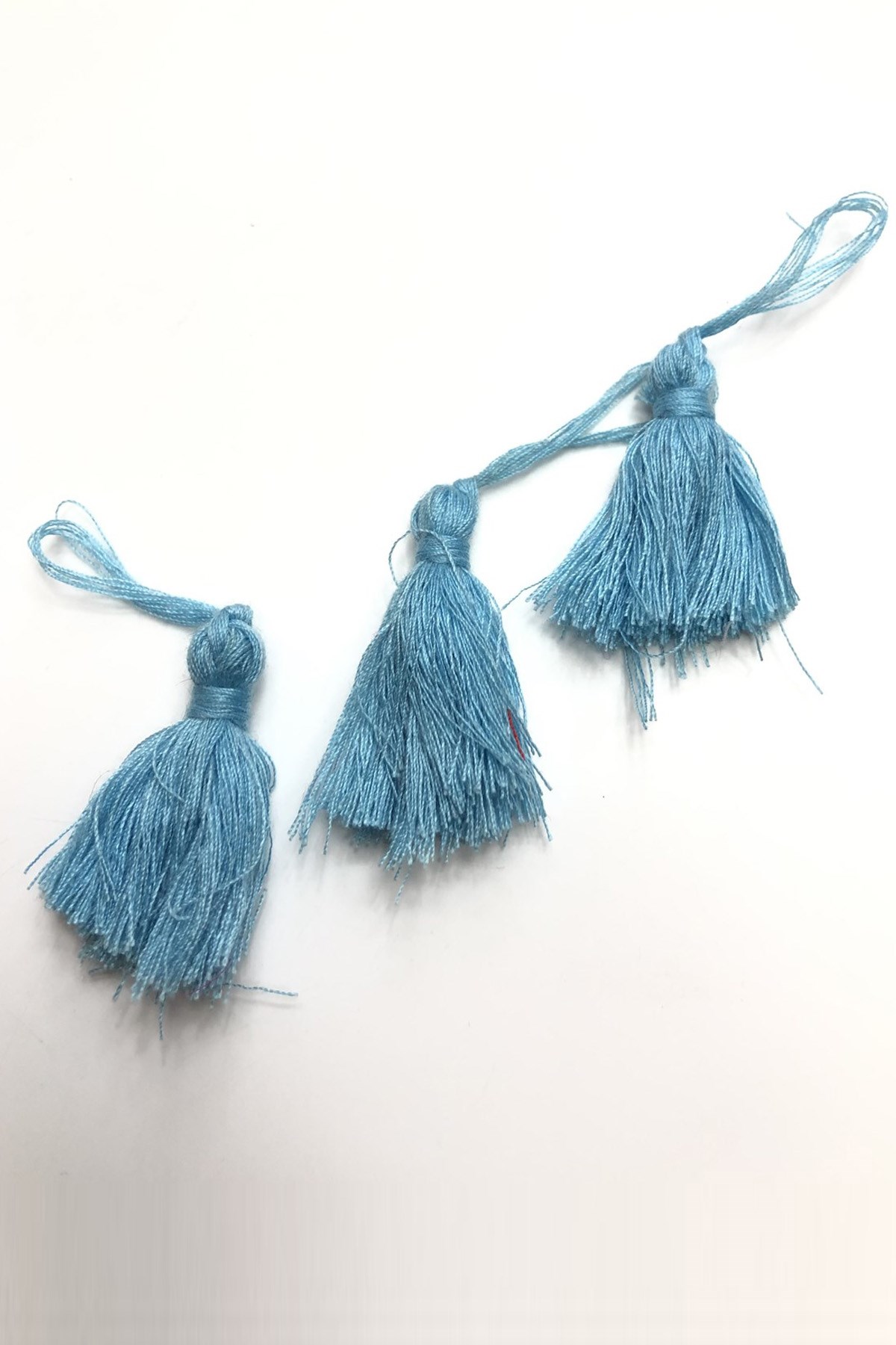 شرابة قطن تركواز 10 قطع 4 سم