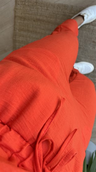 Beli Lastikli Turuncu Kolsuz Tulum