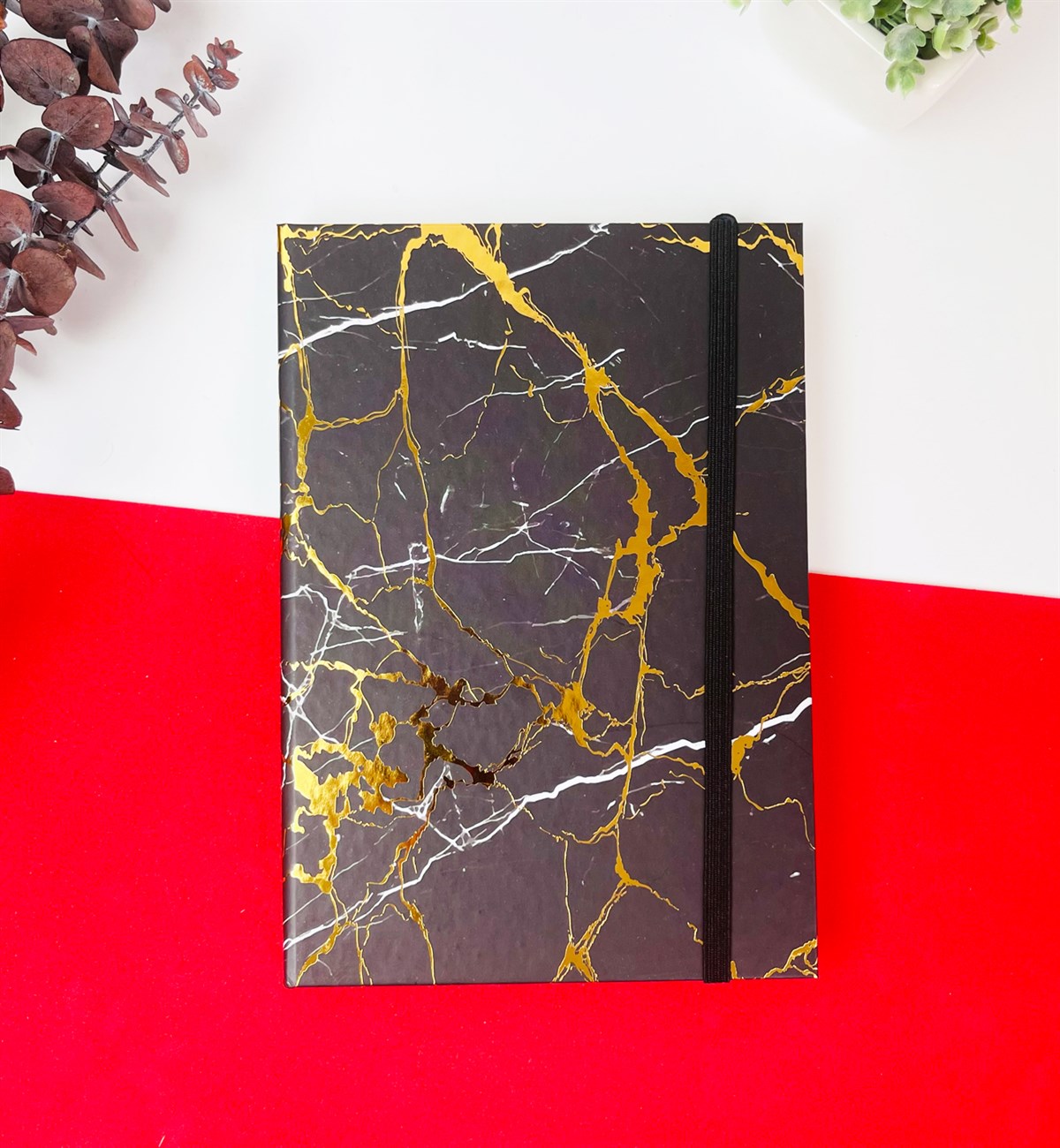 Altın Yaldızlı Siyah Mermer Tasarımlı Lastikli Defter	giftmodaGmd100115