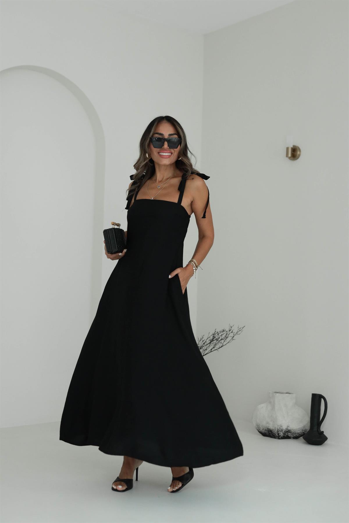 9106 Gipeli Askılı Dokuma Çan Elbise