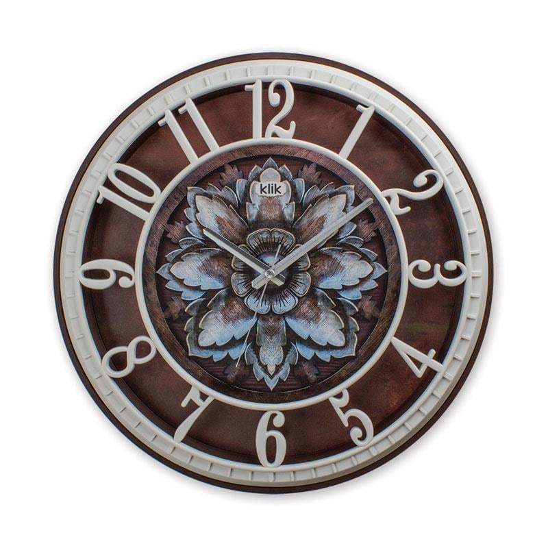 Klik Hisar Lotus Çiçek Desenli duvar saatinin ön cephe görseli. Beyaz çerçeveli, mavi tonlarında lotus çiçeği desenli ve modern tasarımlı.