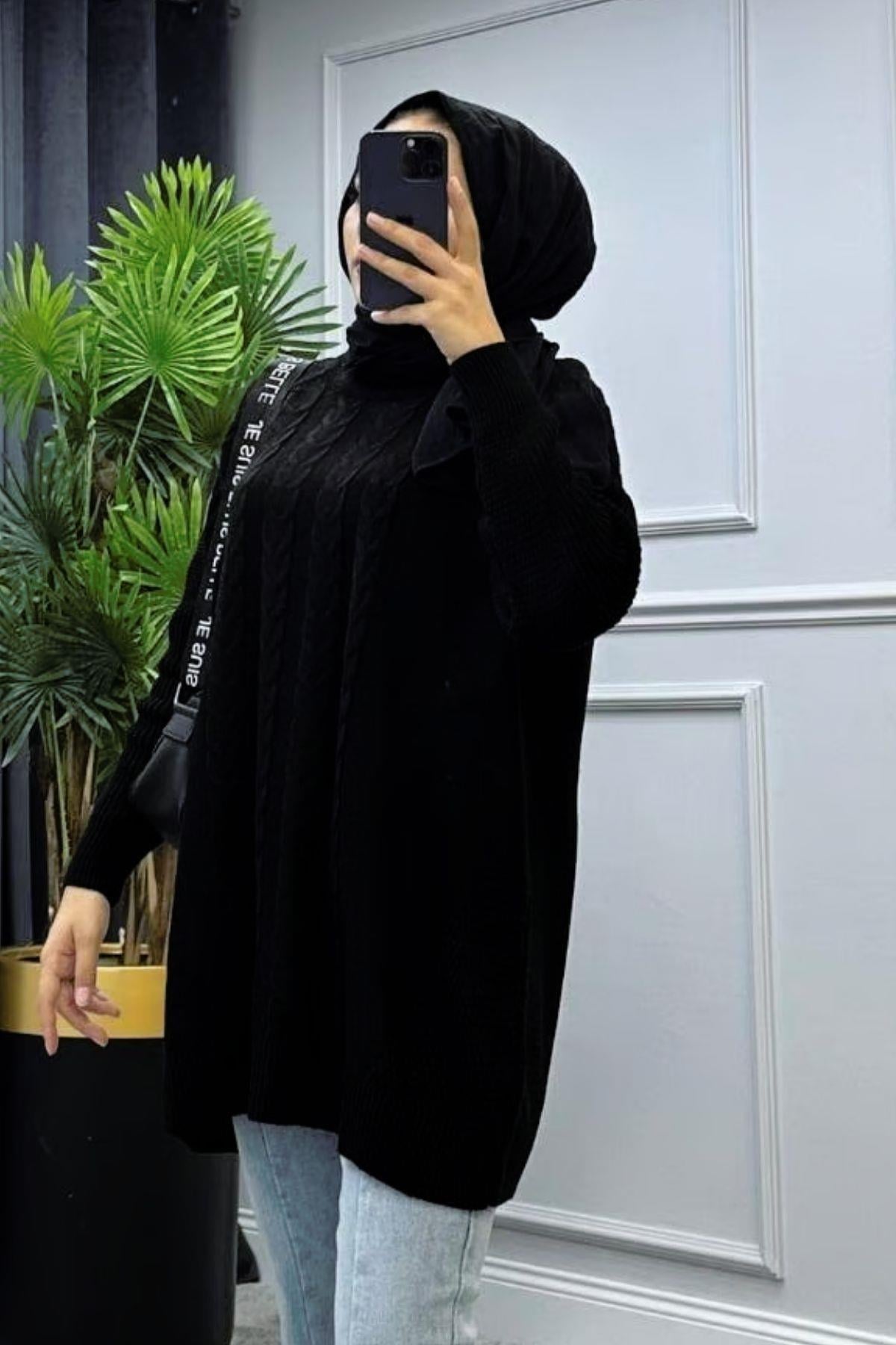 سترة شبه محبوكة باللون الأسود