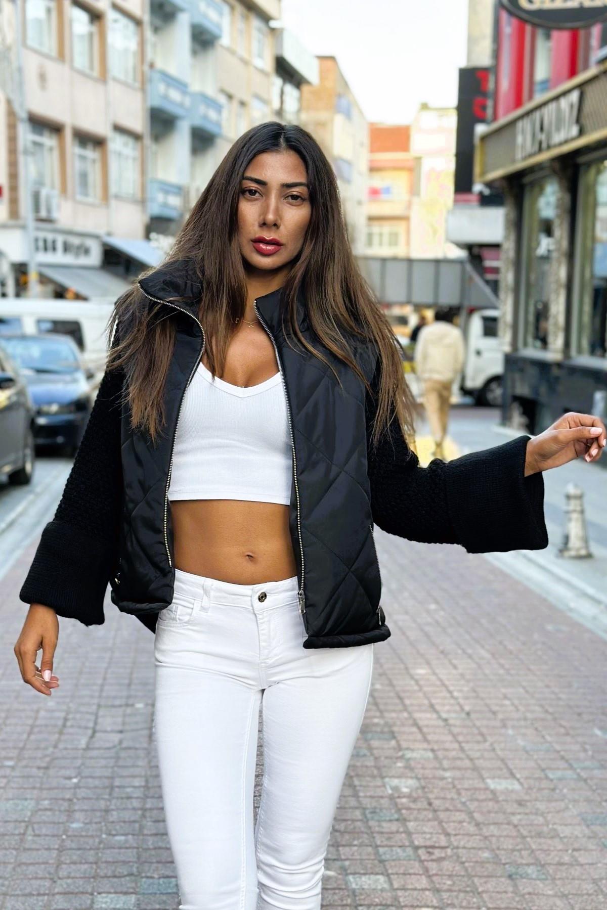 معطف قابل للنفخ أسود بياقة قائمة وأكمام بياقة قائمة وجيوب تريكو بسحاب