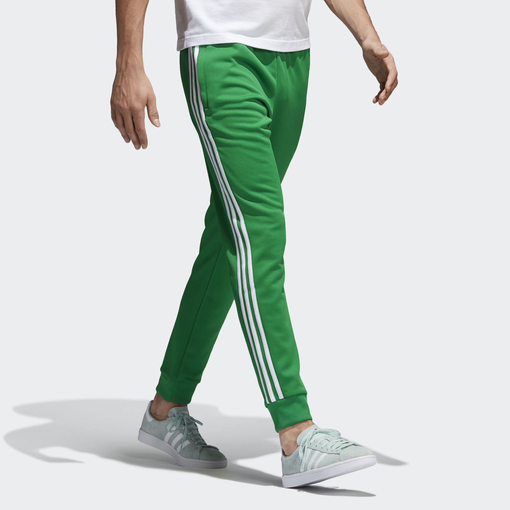 Адидас зеленый спортивный. Adidas SST track Pants. Брюки adidas SST зеленые. Adidas track Pants мужские. Штаны adidas Originals зеленые.