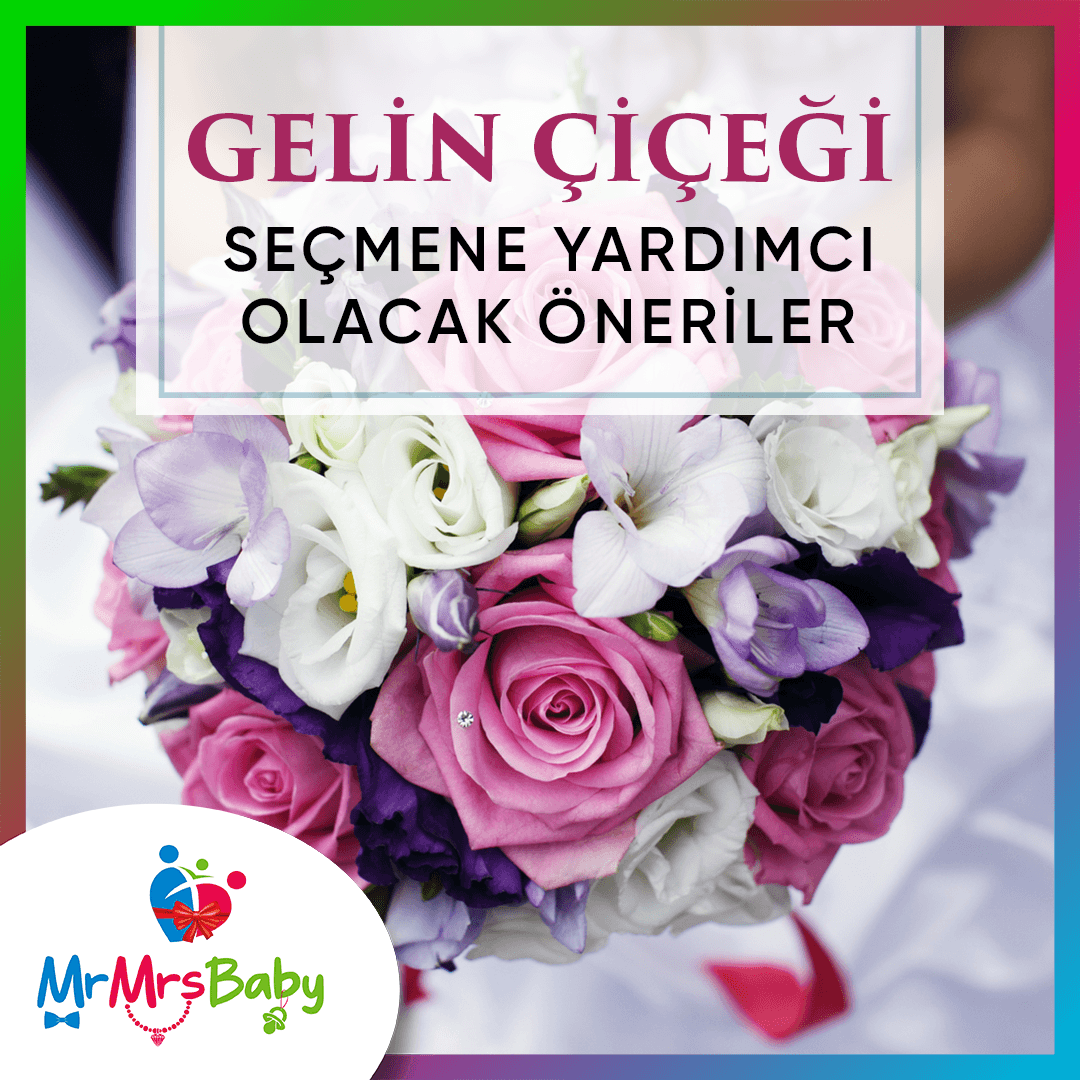 Beyaz işlemeli straplez gelinlik önünde tutulan pembe, beyaz ve açık yeşil çiçekli, koyu yeşil yapraklı gelin buketi