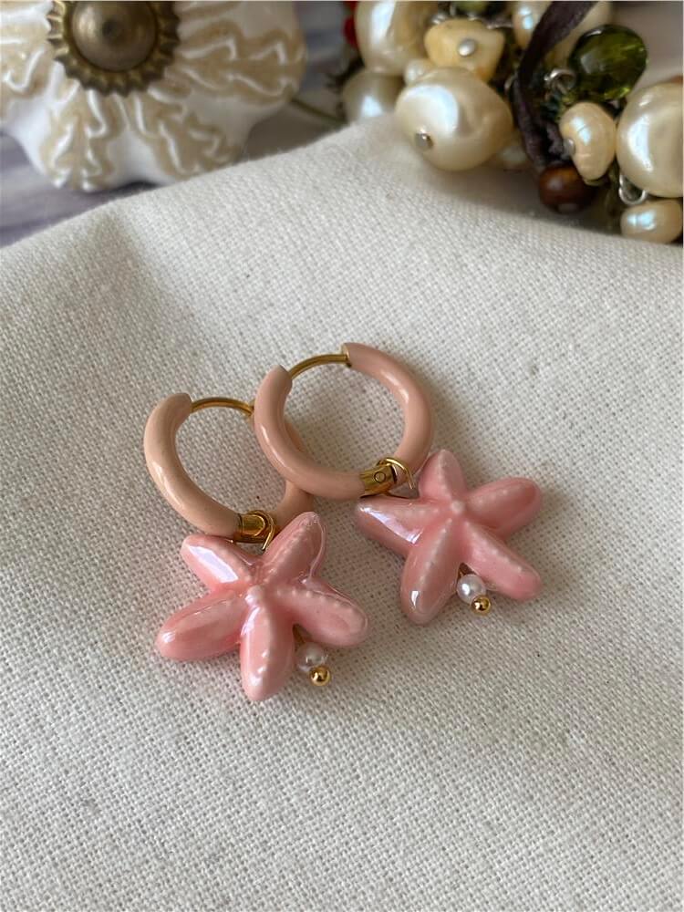 Çelik Detaylı Porselen Pembe Denizyıldızı Küpe