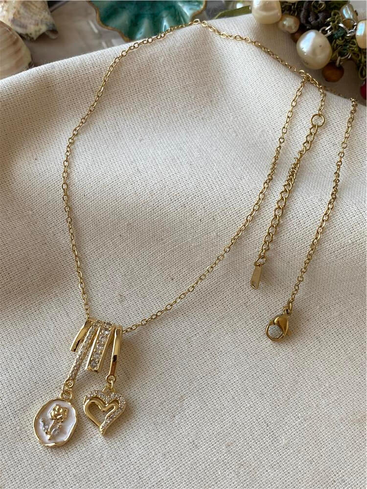 Çelik Gold Kalp ve Gül Sallantılı Kolye