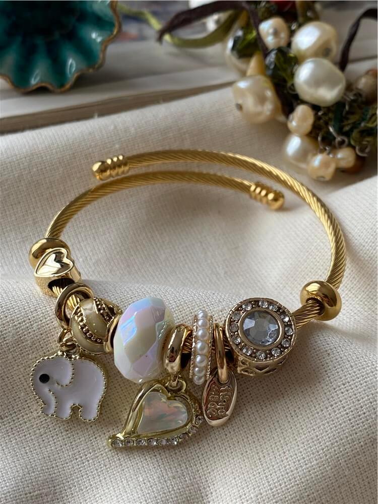 Çelik Gold Kordonlu Beyaz Fil Charmlı Bileklik