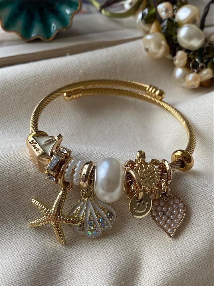 Çelik Gold Kordonlu Beyaz Kabuklu Denizyıldızı Charmlı Bileklik