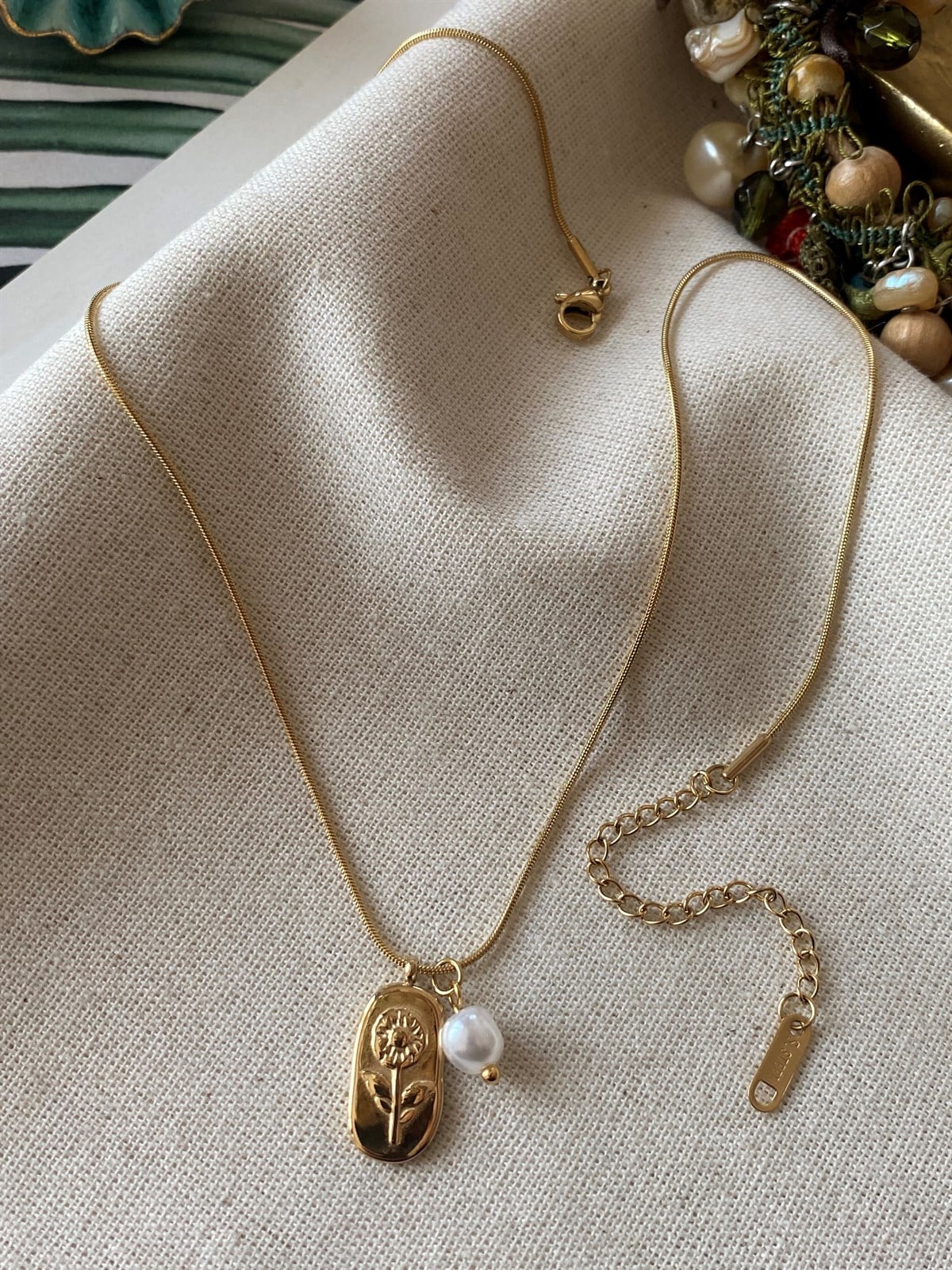 Çelik İnci Çiçek Kolye