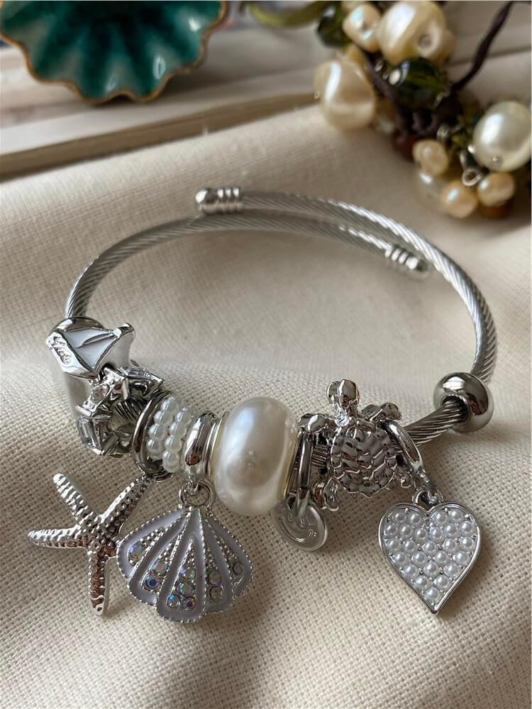 Çelik Kordonlu Beyaz Kabuklu Denizyıldızı Charmlı Bileklik