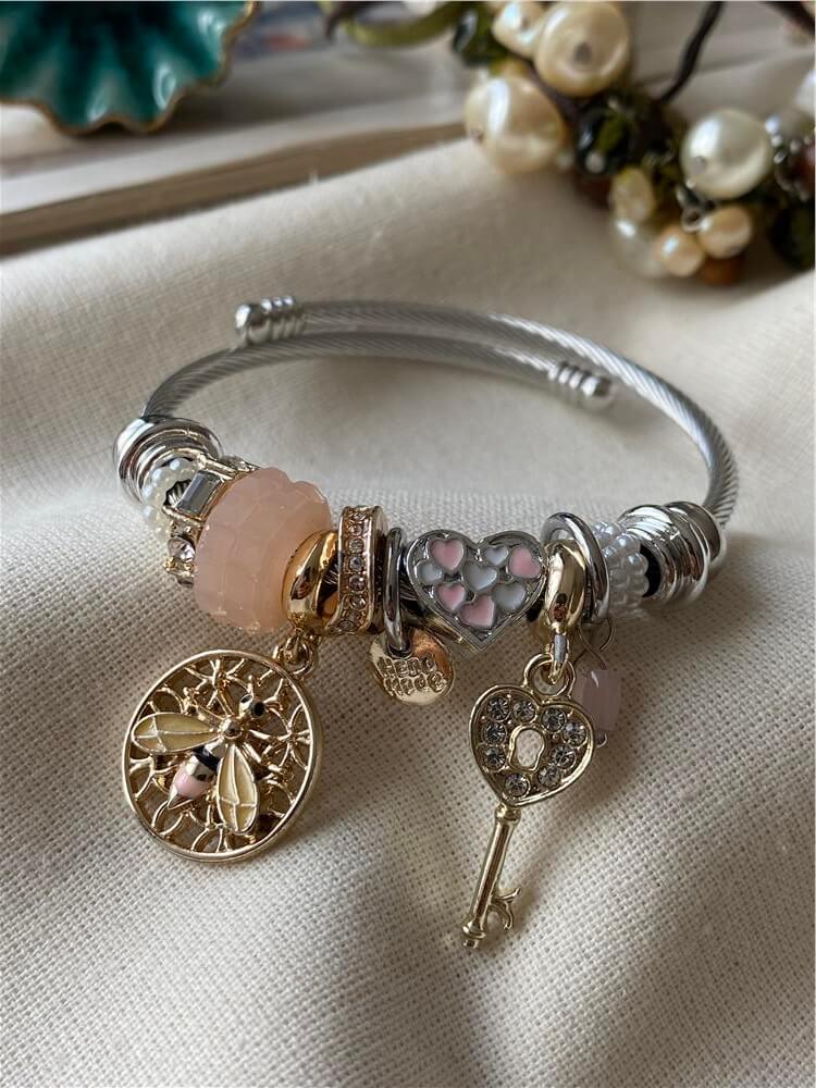 Çelik Kordonlu Pembe Taşlı Arı Charmlı Bileklik