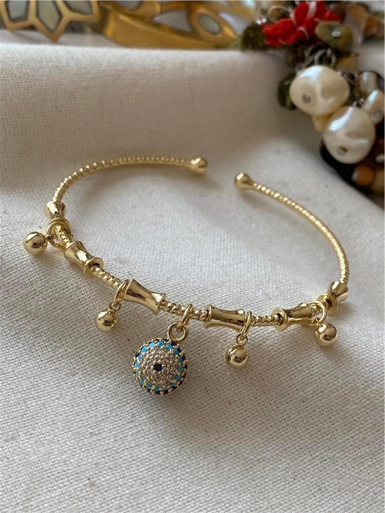 Gold Dorika ve Taşlı Göz Boncuk Sallantılı Bileklik