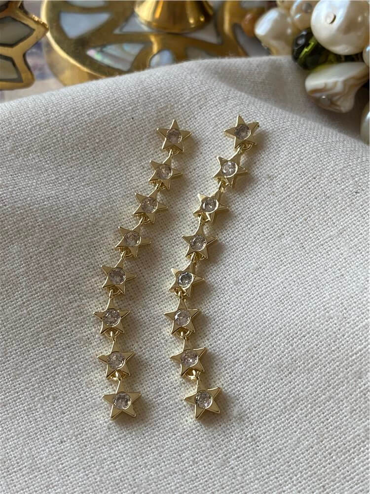 Taşlı Sıralı Gold Yıldızlar Küpe