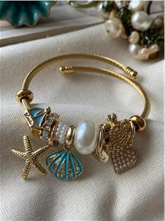 Çelik Gold Kordonlu Mavi Kabuklu Denizyıldızı Charmlı Bileklik