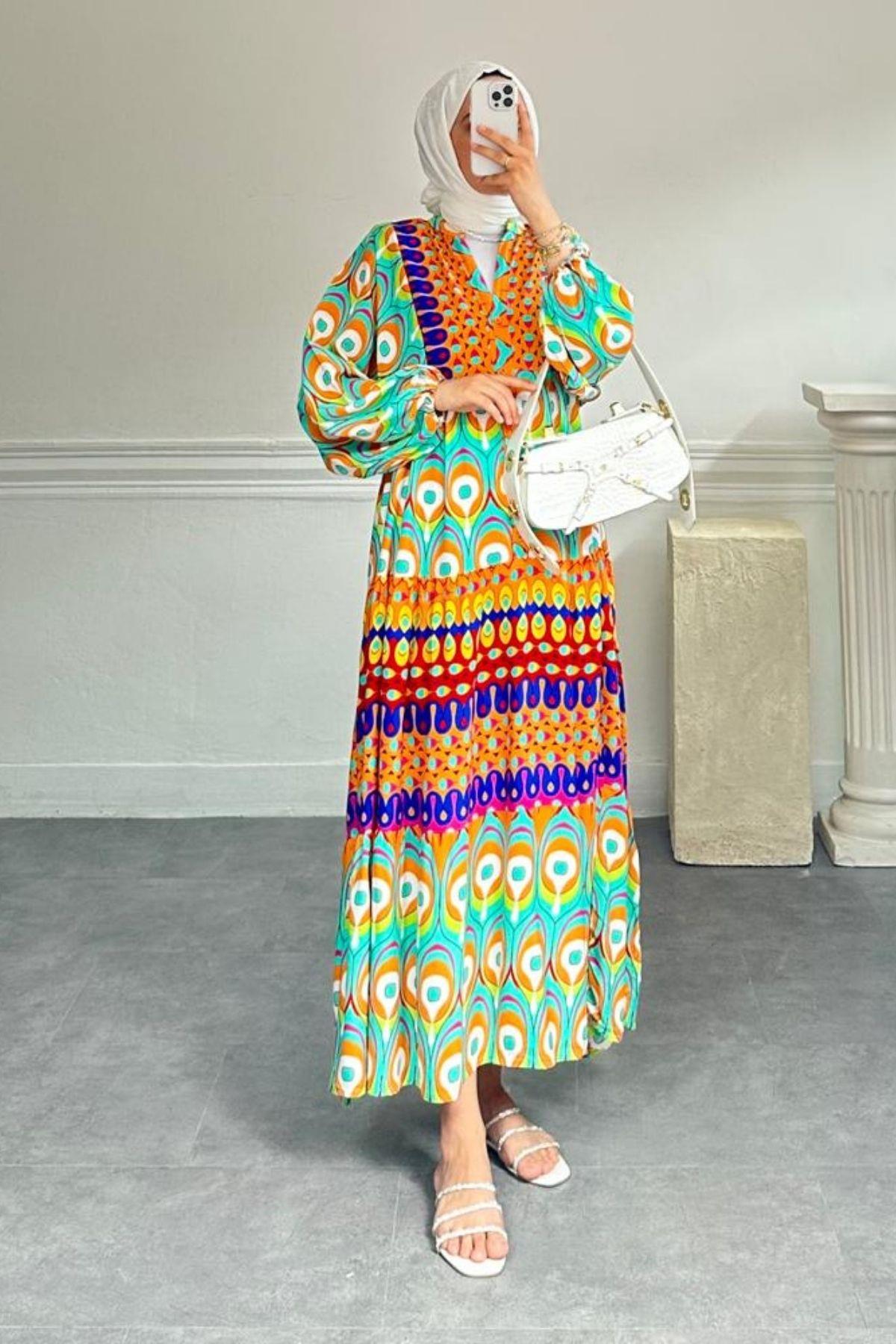 TURUNCU DESENLİ ELBİSE