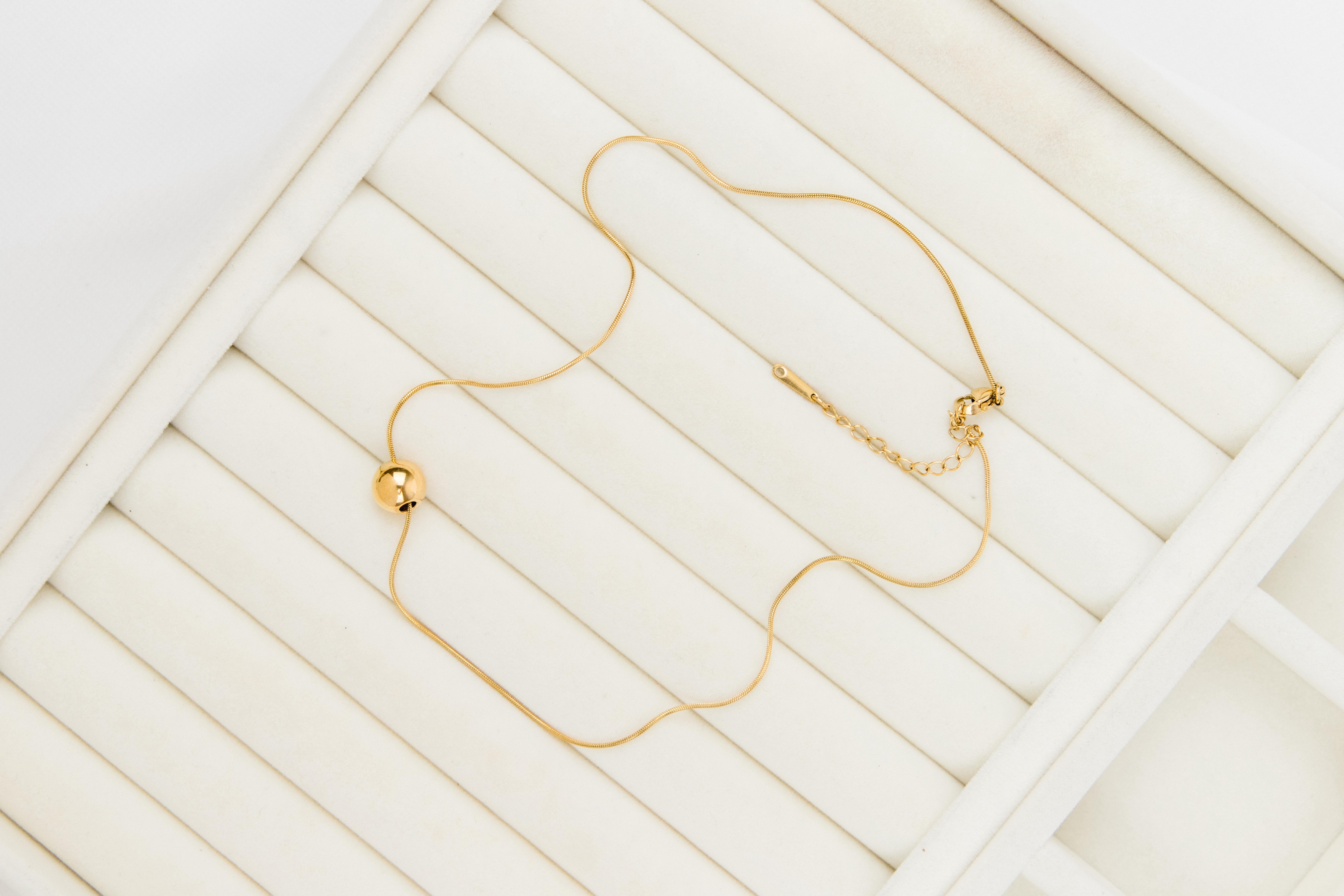 Topçuk Biyeli Yılan Zincirli Gold Çelik Kolye